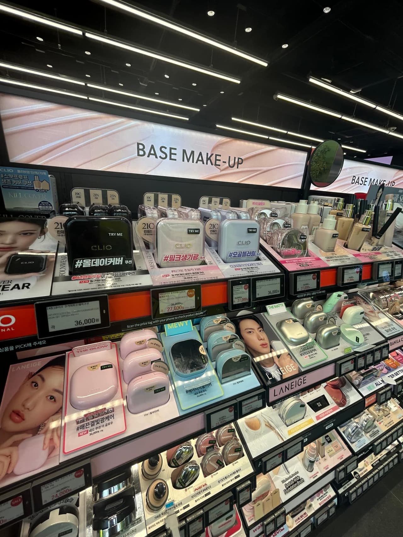 Base makeup shelf with cushion foundation products inside Olive Young Hongdae