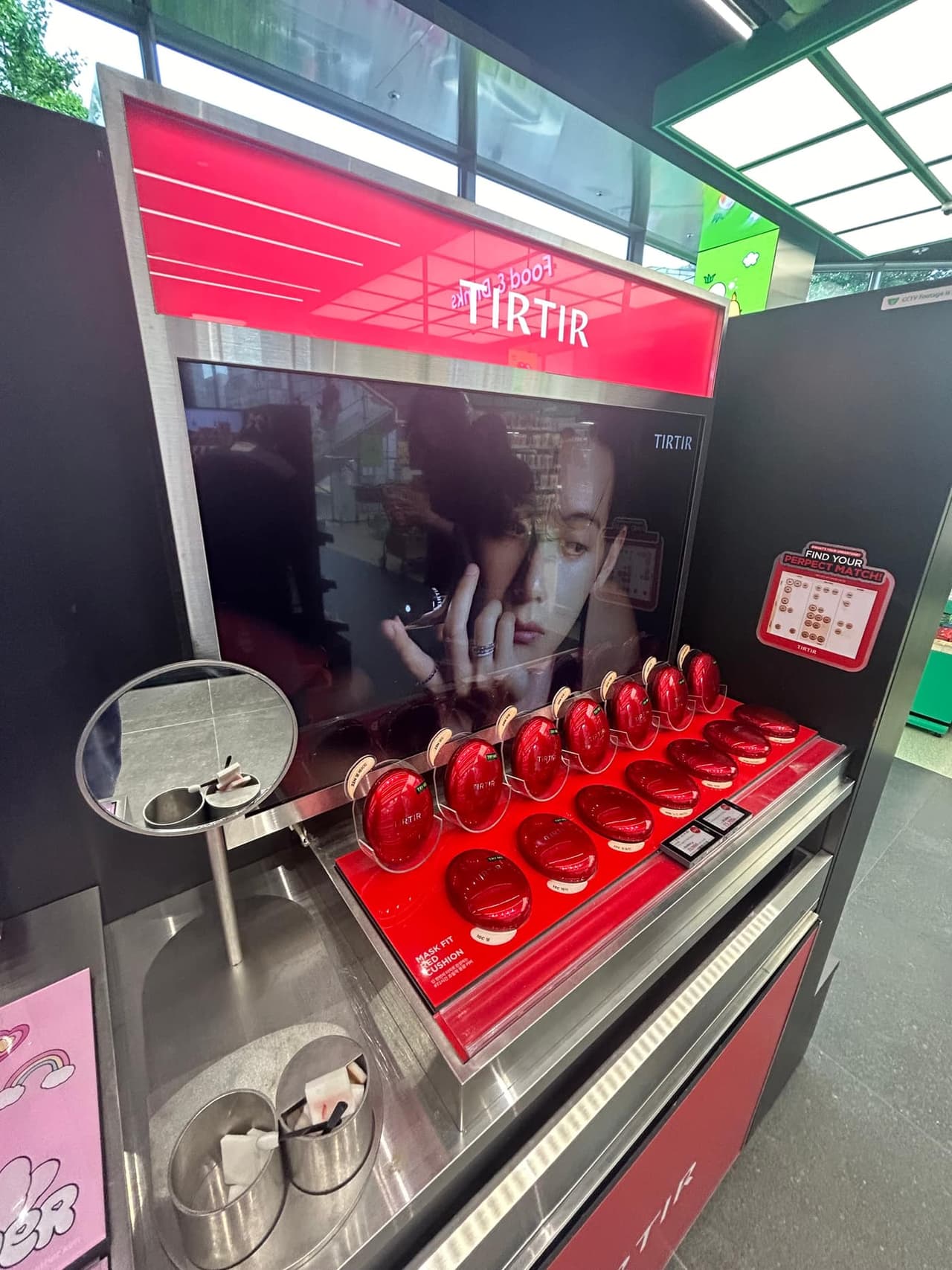 Close-up cushion foundation display inside Olive Young Hongdae