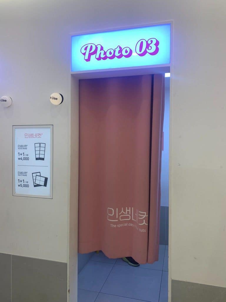 Life4Cuts booth entrance with Photo 03 number and in-use light