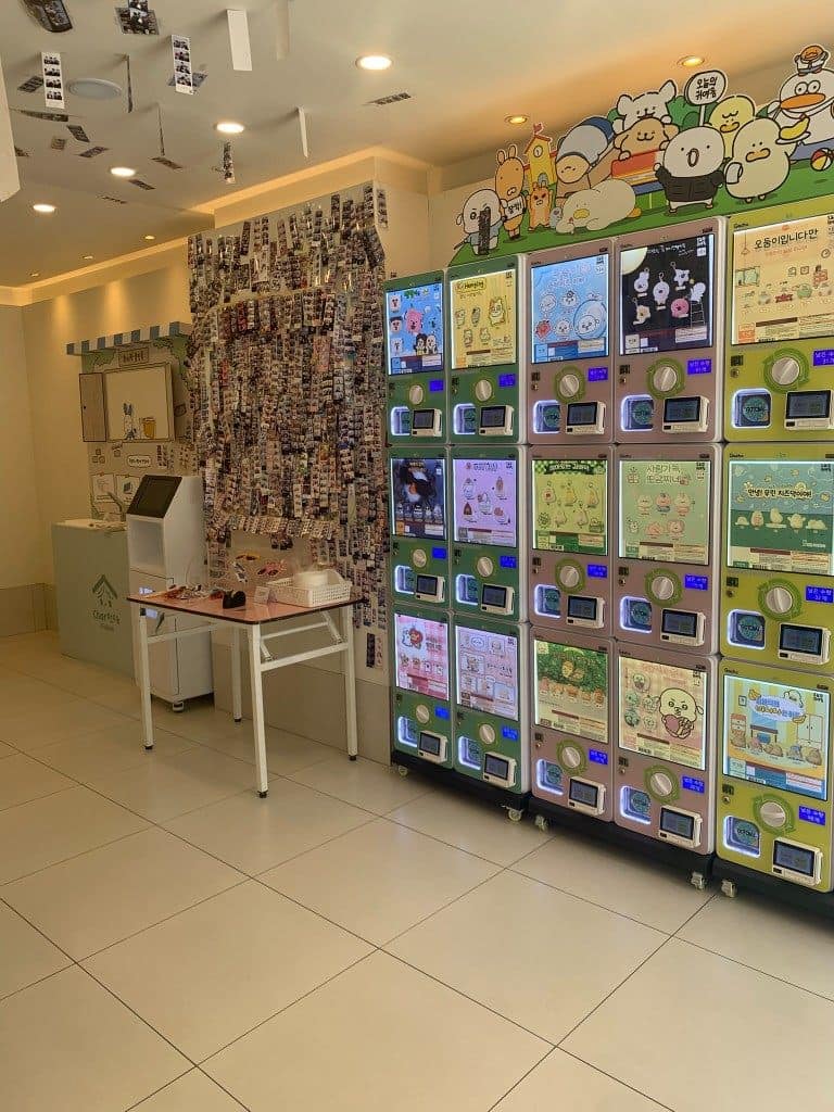 Life4Cuts Hongdae interior with photo wall, mirror area, and vending machines