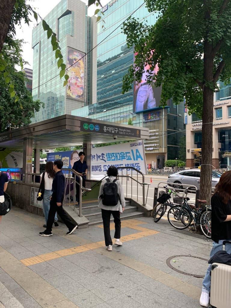 Hongik University Station Exit 8, a useful landmark for getting to Olive Young Hongdae Town