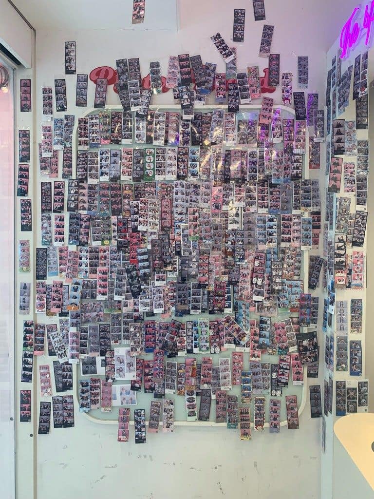 Life4Cuts Hongdae photo strip wall filled with visitor prints